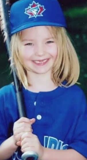 Young Dove Cameron smiling at the camera